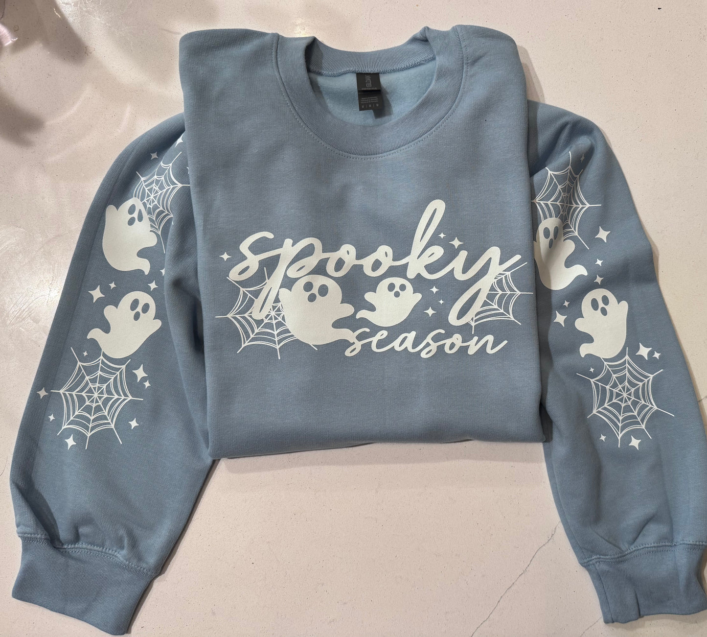 Spooky ghost crewneck sweatshirt w/arm detail.